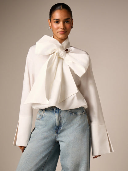 AiiRZ Elegant Oversized Bow Detail Blouse With Long Bell Sleeves High Neck And Bubble Hem For Office And Special Occasions