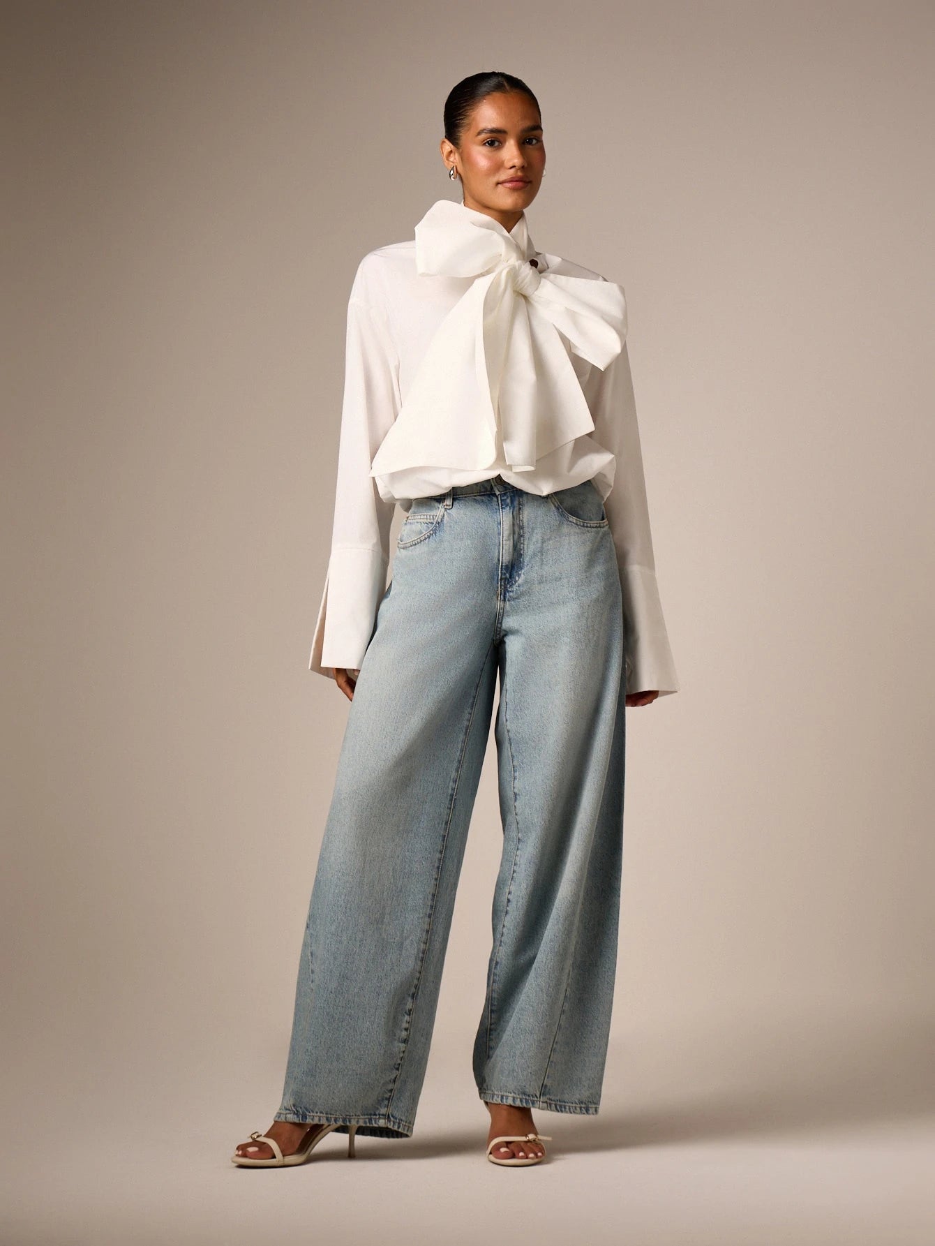 AiiRZ Elegant Oversized Bow Detail Blouse With Long Bell Sleeves High Neck And Bubble Hem For Office And Special Occasions