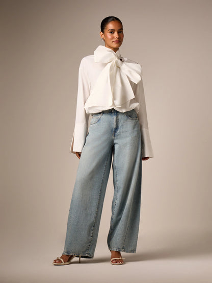 AiiRZ Elegant Oversized Bow Detail Blouse With Long Bell Sleeves High Neck And Bubble Hem For Office And Special Occasions