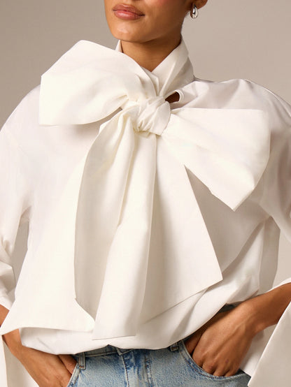 AiiRZ Elegant Oversized Bow Detail Blouse With Long Bell Sleeves High Neck And Bubble Hem For Office And Special Occasions
