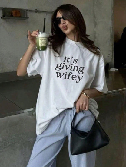 "Its Giving Wifey" Plus Size Crew Neck Short Sleeve T-Shirt- Bride-To-Be T-Shirt, Newlywed T-Shirt, Honeymoon T-Shirt Casual Black Summer